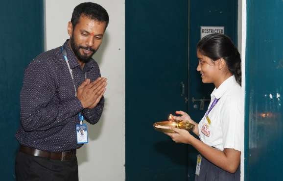 Greeting teacher with Namaste and Aarti