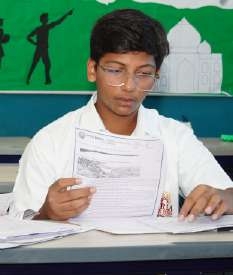 Student interviewer holding questionnaire sheet