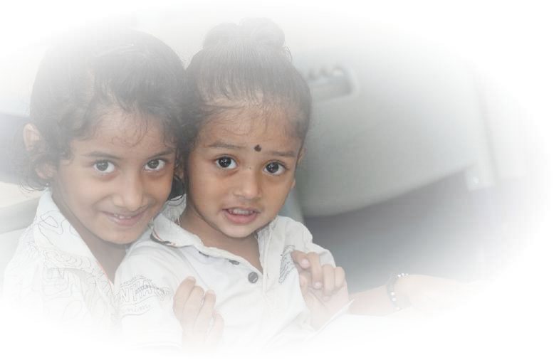 Two smiling young primary school girls