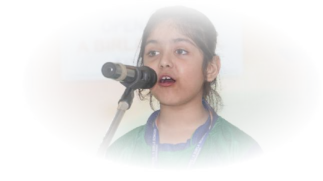 Young girl reciting into microphone