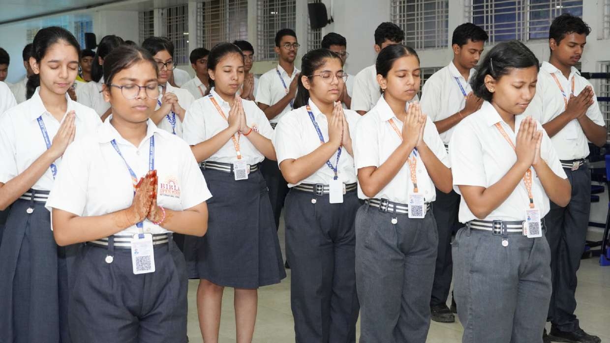 Students in deep concentration during morning assembly prayer