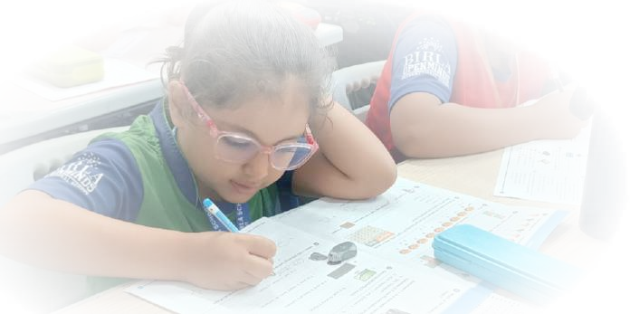 Young Primary Scholar Engaged in Deep Problem-Solving