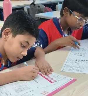 Student tackling unfamiliar Olympiad challenge with poise