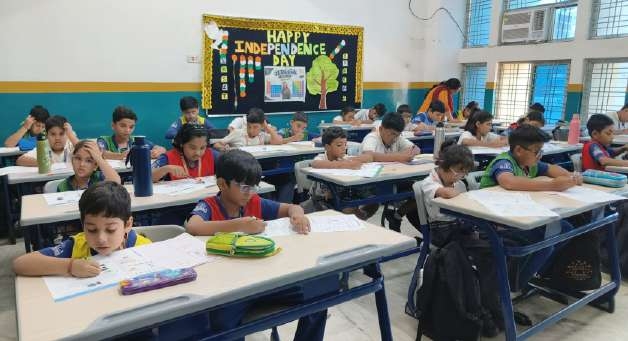 Examination hall in session with students seated at desks