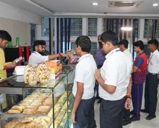 Student having school ID card scanned at the canteen counter