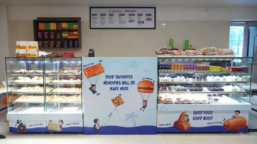 Monginis canteen counter display with freshly stocked shelves