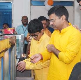 Young scholar lighting the inaugural lamp