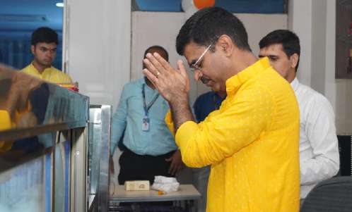 Dignitary offering folded-hands prayer