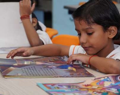 Young Girl Following Storybook Pages