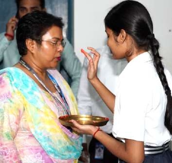 Learner Offering Blessings Plate